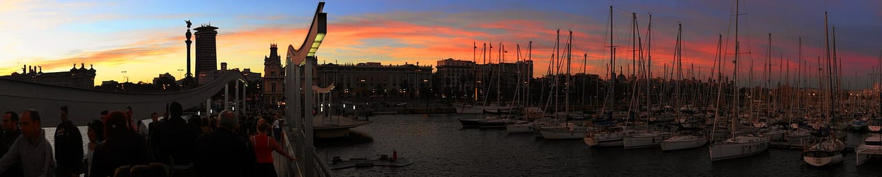 Festival crowd at Primavera Sound by the Barcelona waterfront at dusk